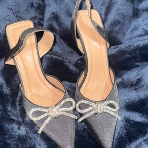 Elegant Black Heels with Bow by [Brand]